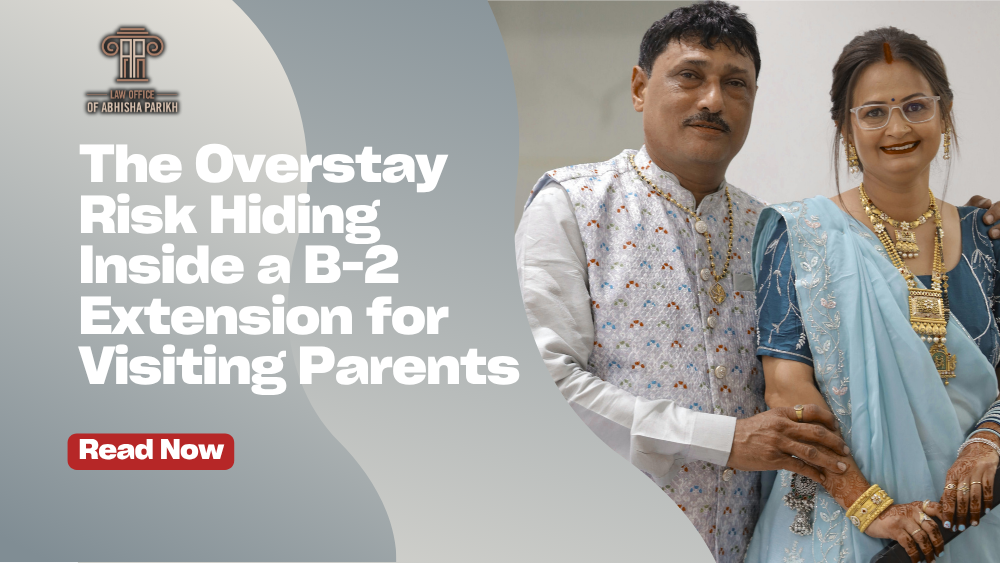 Older Indian couple reviewing B-2 visa extension paperwork with an immigration professional, illustrating the risk of overstaying while visiting the United States.